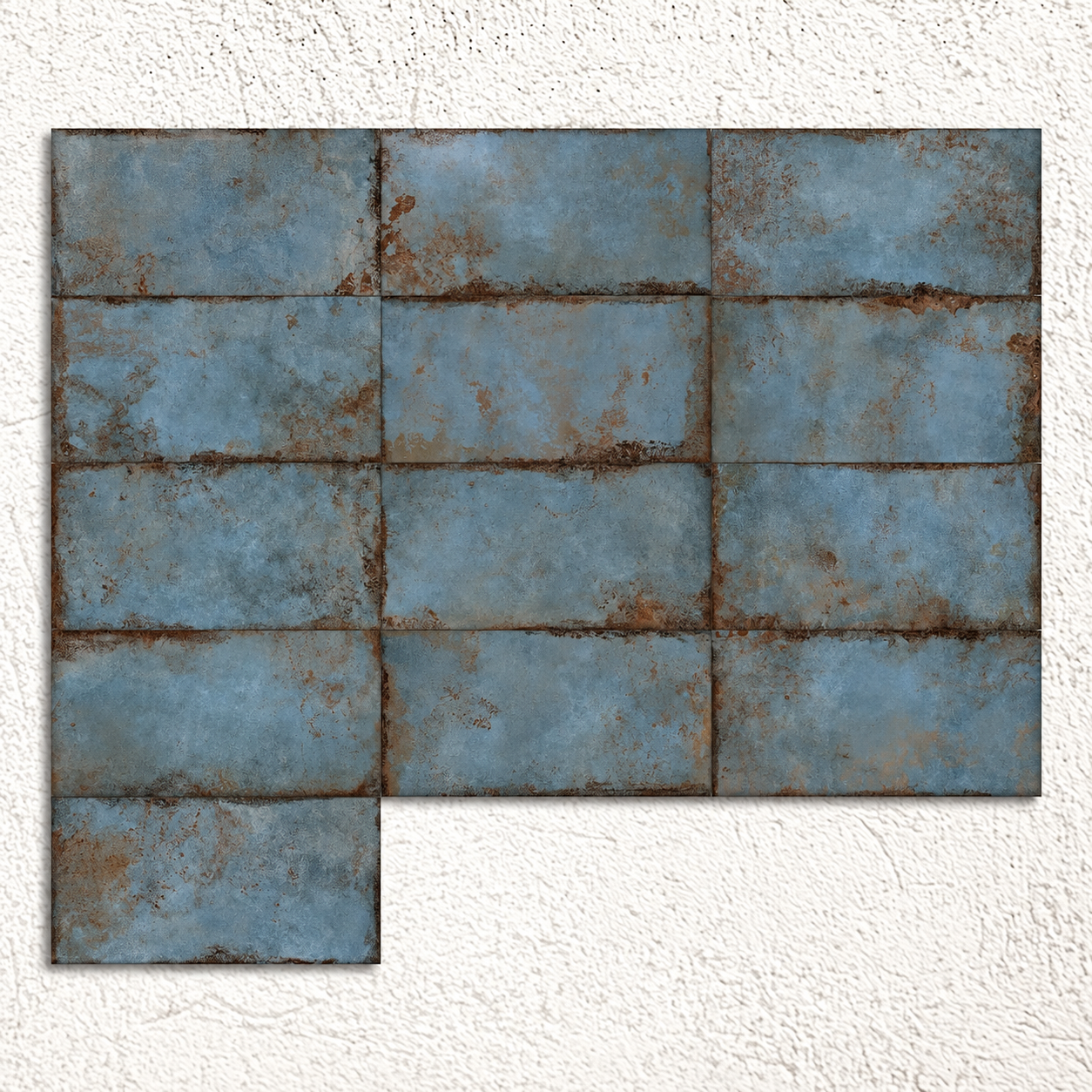 Multiple blue metal-effect tiles arranged to show substantial variation in patina and surface pattern.