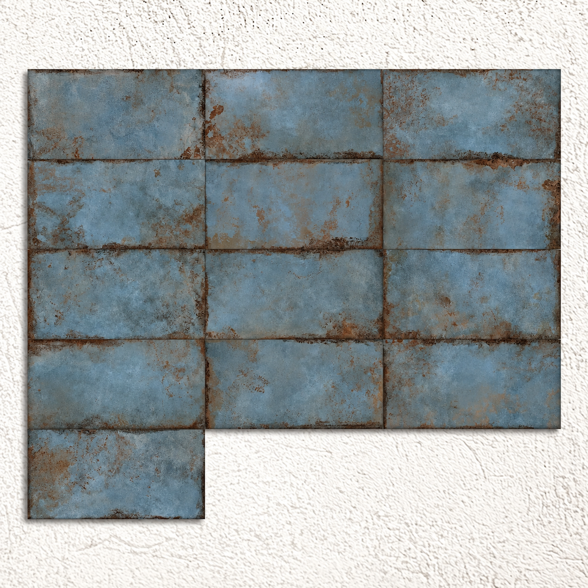 Multiple blue metal-effect tiles arranged to show substantial variation in patina and surface pattern.