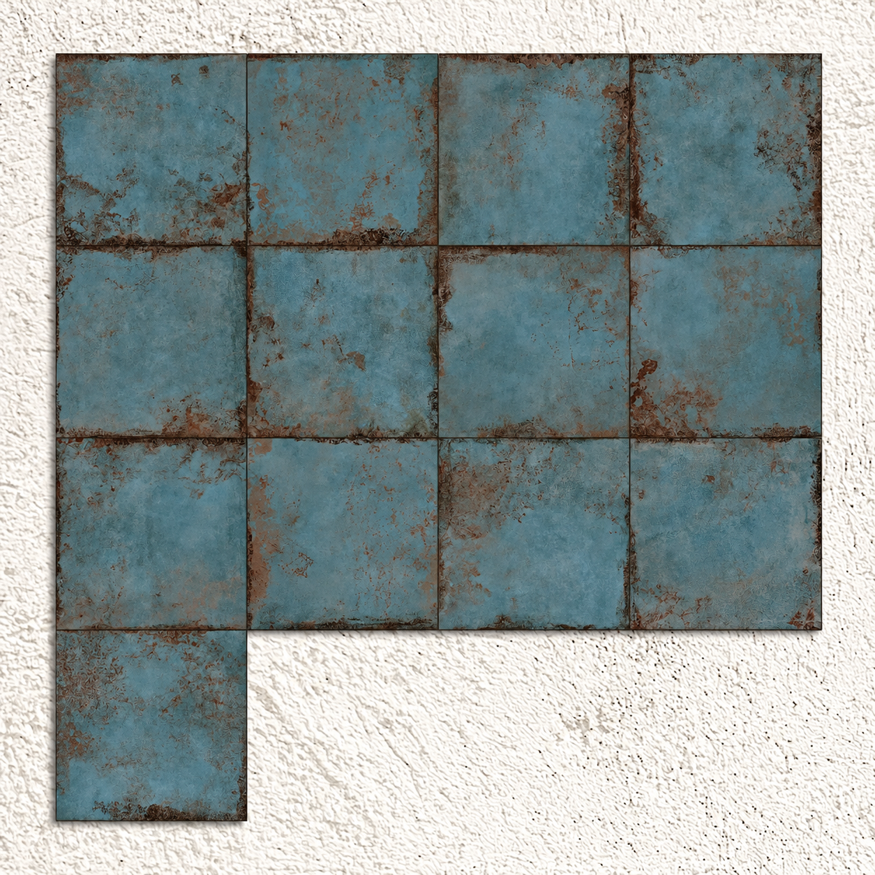 Alloy Azzurro blue metal effect porcelain tiles arranged to show substantial variation in oxidised patterns and colour.