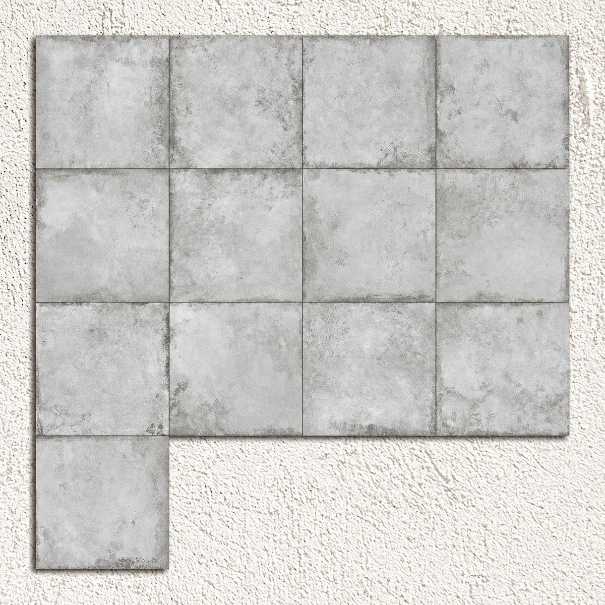 Alloy Pearl matt metal effect porcelain tiles arranged to show variation in pearl-grey shading and surface patterns.