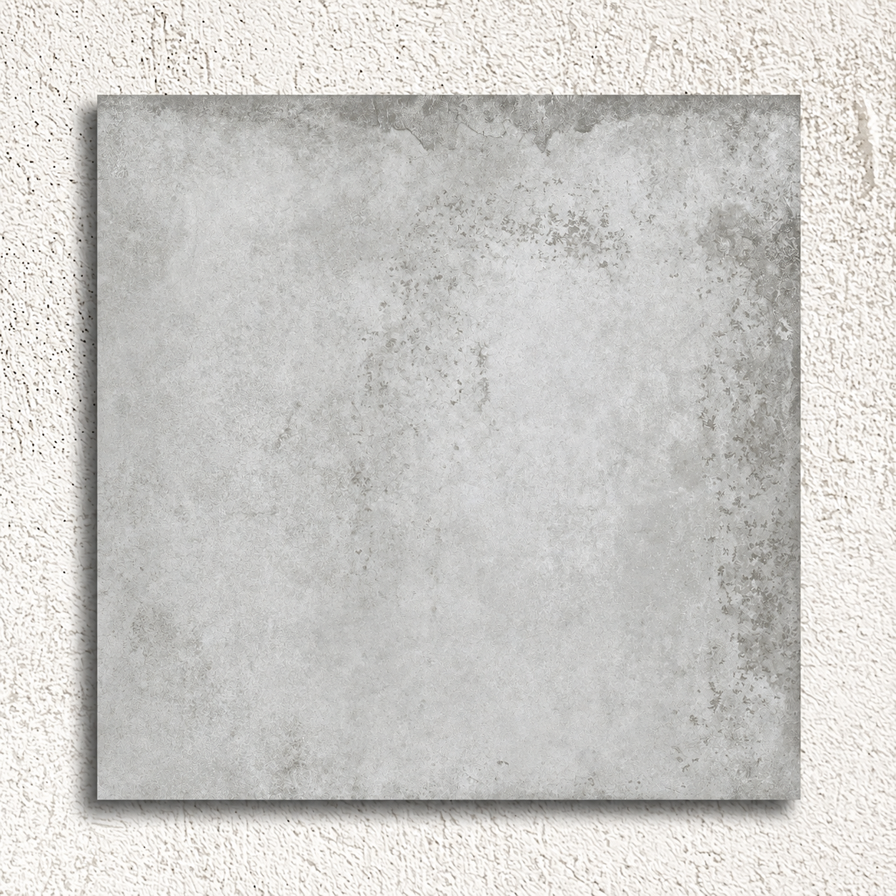 Single Alloy Pearl 600 × 600mm matt porcelain tile showing pale grey tones and weathered metal effect detailing.