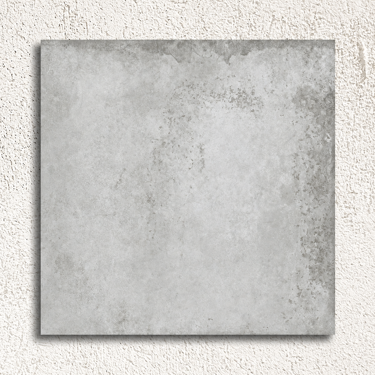 Single Alloy Pearl 600 × 600mm matt porcelain tile showing pale grey tones and weathered metal effect detailing.