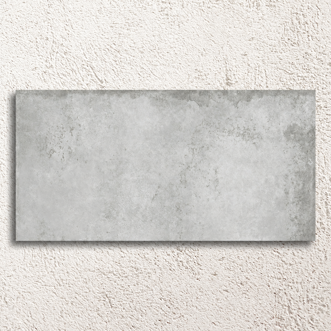 Single Alloy Pearl 600 × 1200mm semi-polished porcelain tile with pale grey weathered metal effect detailing.