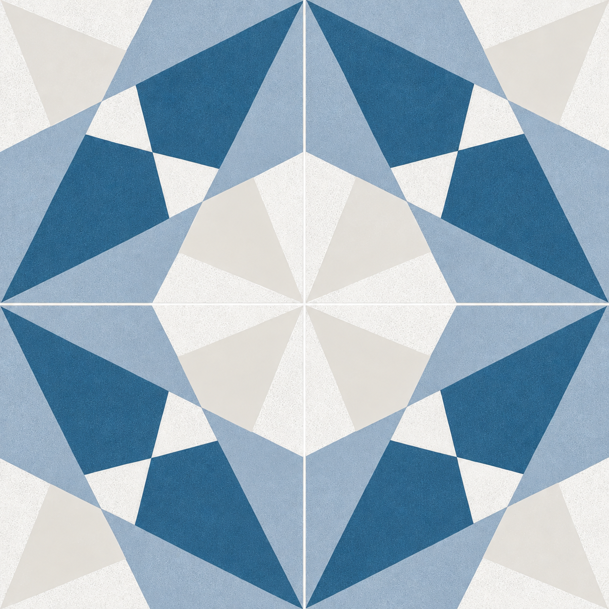 Close-up of four Altea Blue Taco tiles forming a blue and white geometric pattern with pale grout.