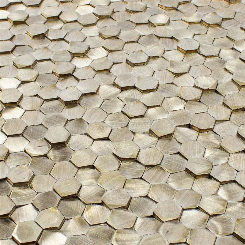 Bronze metallic mosaic tile sheet showing geometric hexagon pattern and textured finish