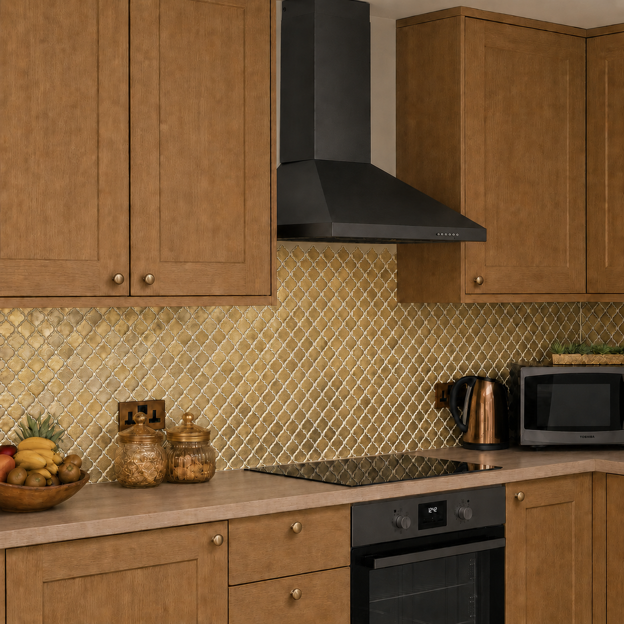 Gold glass decorative splashback in kitchen wall setting 