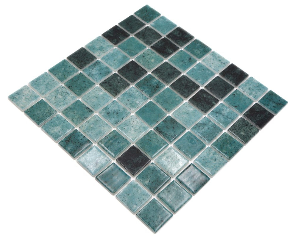 Multi-tone green glass mosaic pool tiles with lagoon-inspired aquatic shading
