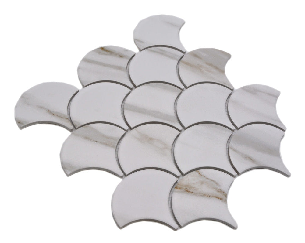 Angled product shot of Calacatta Gold Marble Scallop Mosaic Tile sheet with fan-shaped ceramic chips and golden vein detail