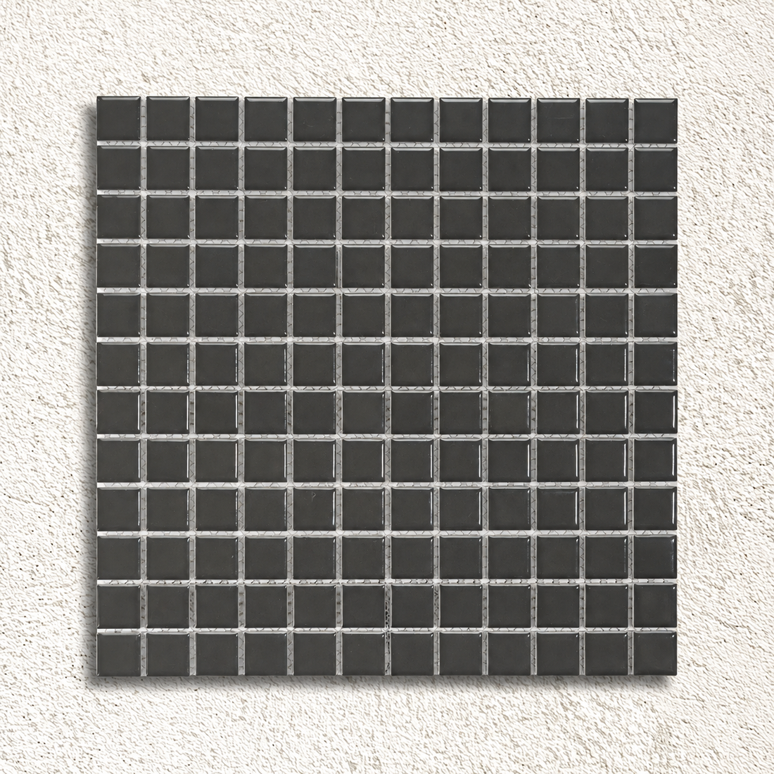 Ceramic Pool Gunmetal Grey Mosaic Tile sheet featuring glossy 23 × 23mm dark grey porcelain squares with visible mesh backing.