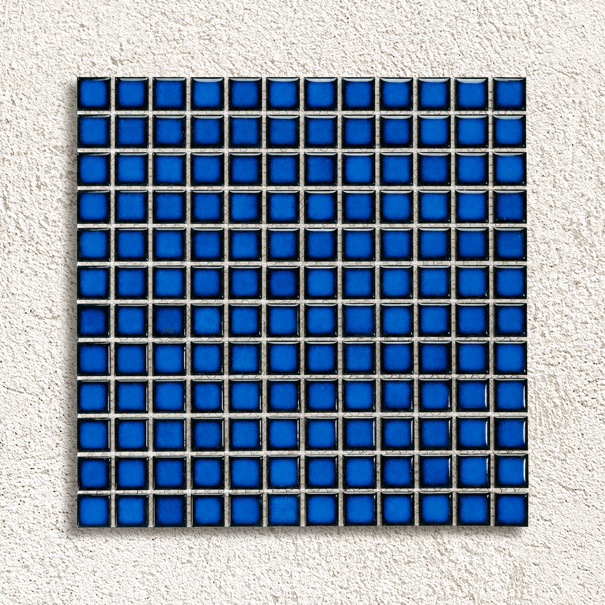 Ceramic Pool Sapphire Mosaic Tile sheet showing glossy 23 × 23mm porcelain squares with blue centres and dark navy edges.