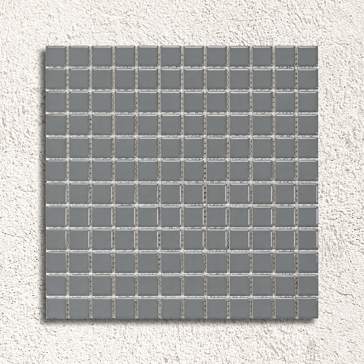 Ceramic Pool Steel Grey Mosaic Tile sheet showing glossy grey 23mm porcelain squares with visible mesh backing against a textured white background.