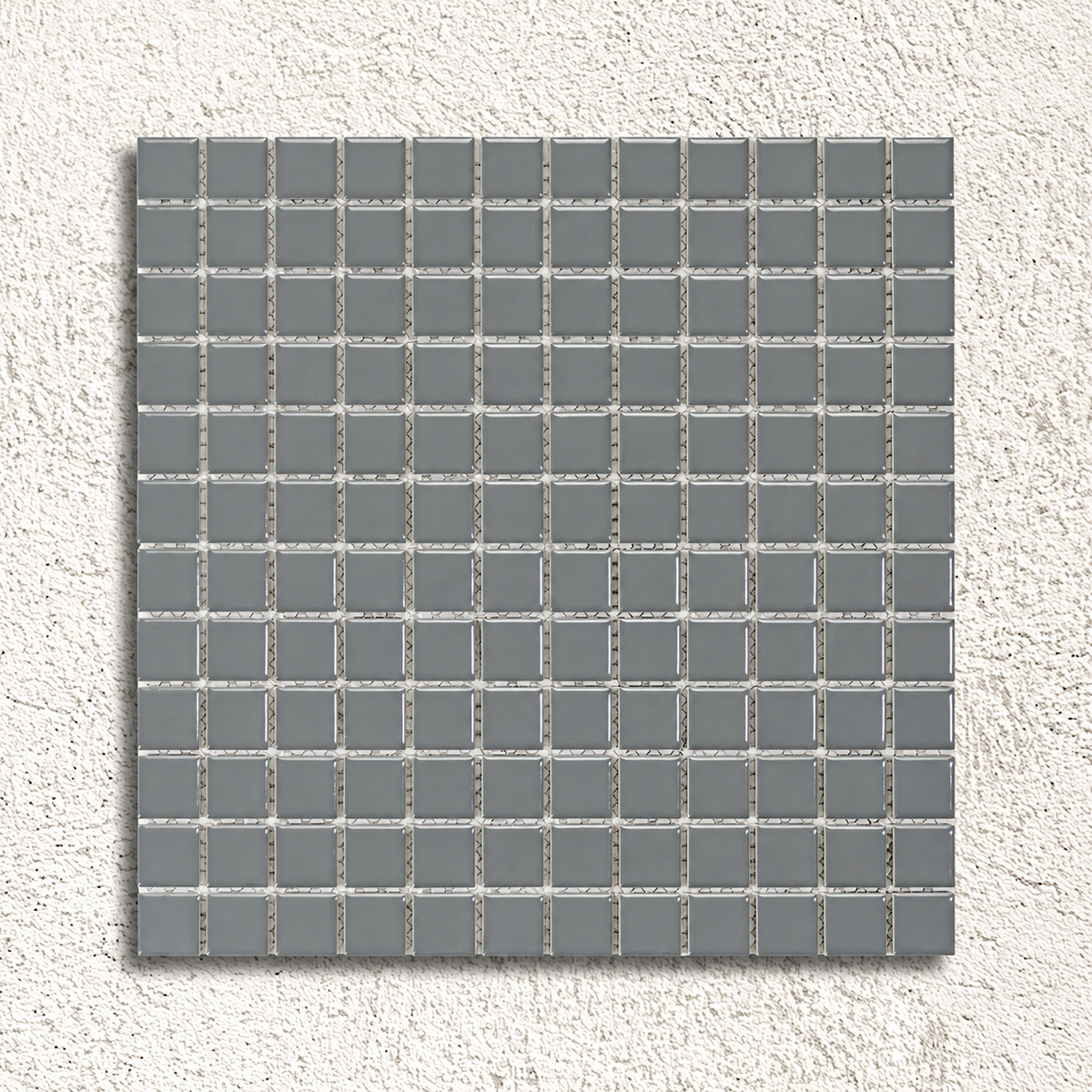 Ceramic Pool Steel Grey Mosaic Tile sheet showing glossy grey 23mm porcelain squares with visible mesh backing against a textured white background.