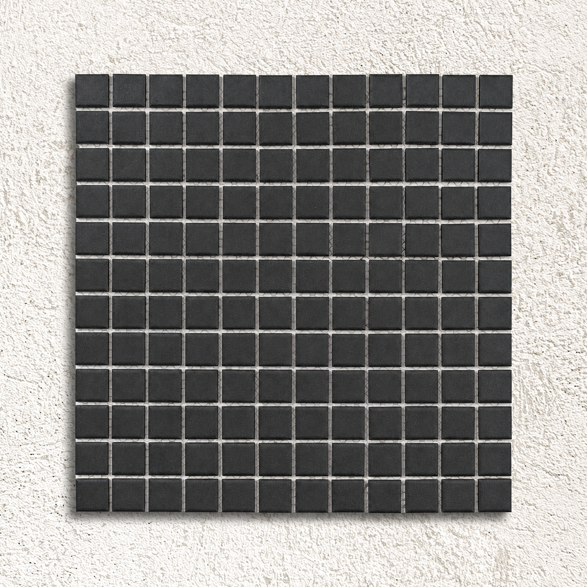 Ceramic Pool Unglazed Black Mosaic Tiles with matt black square porcelain chips and visible mesh backing on a pale textured background.