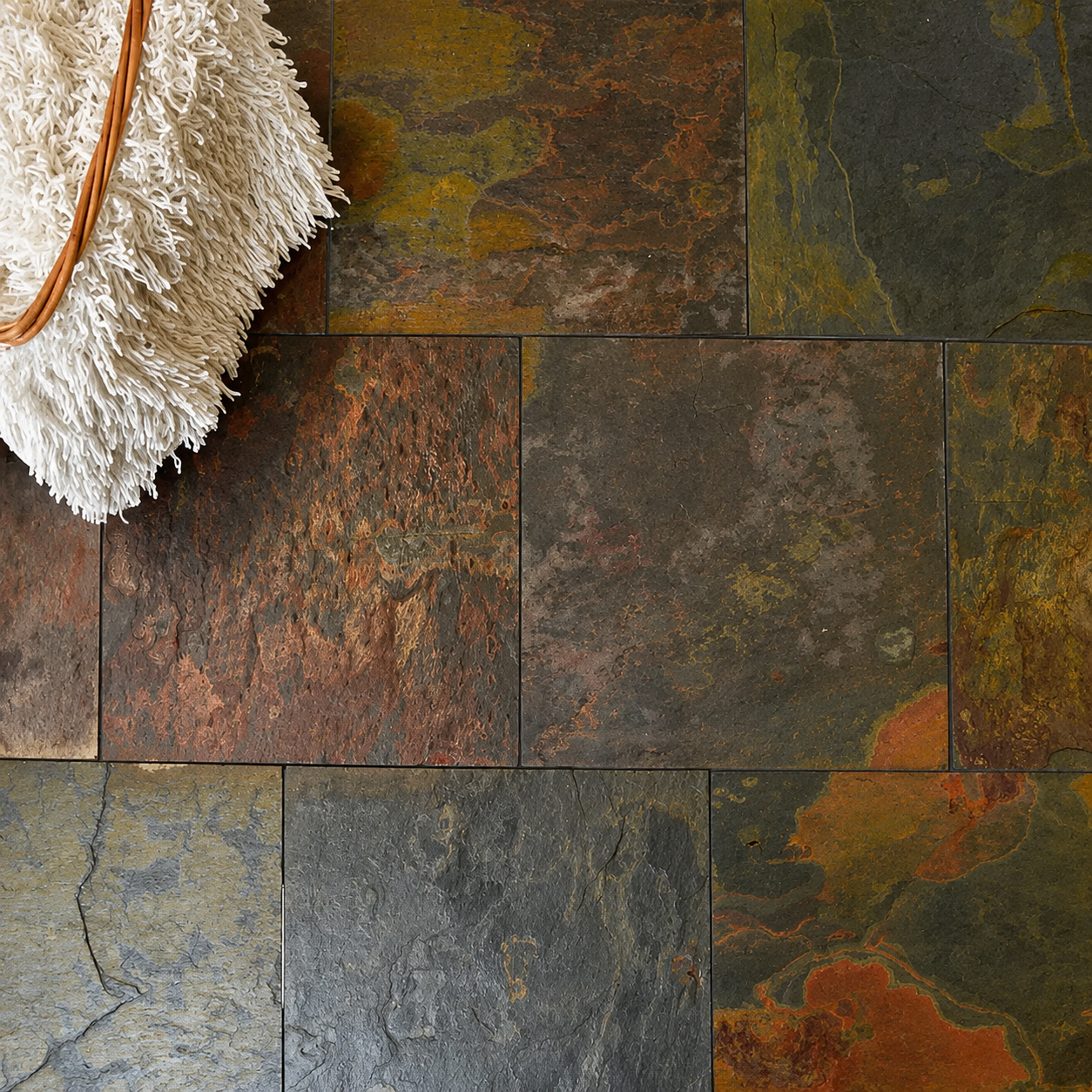 Country Farmhouse Multicolour Slate Tiles installed in a rustic floor with natural copper, charcoal, olive and rust tones.