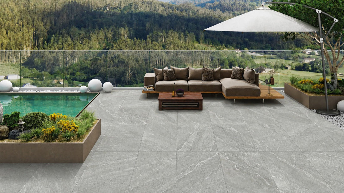 Outdoor grey stone effect tiles in patio 