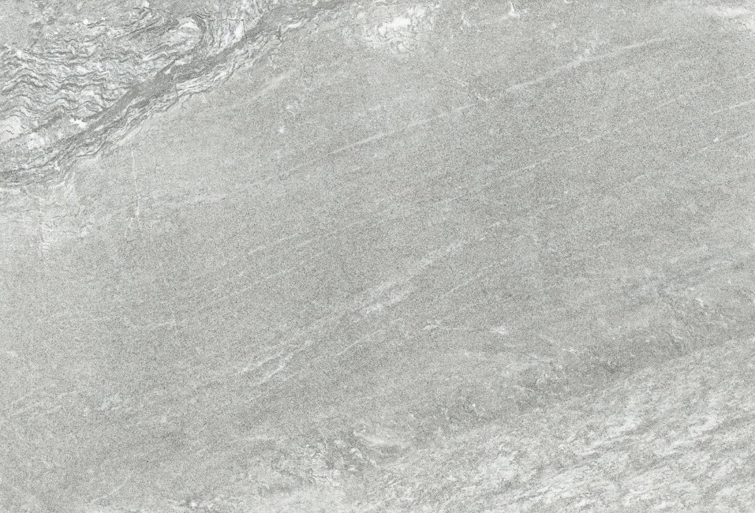 Grey 60 × 90 cm stone-effect porcelain paving slabs used in a modern landscaped garden.