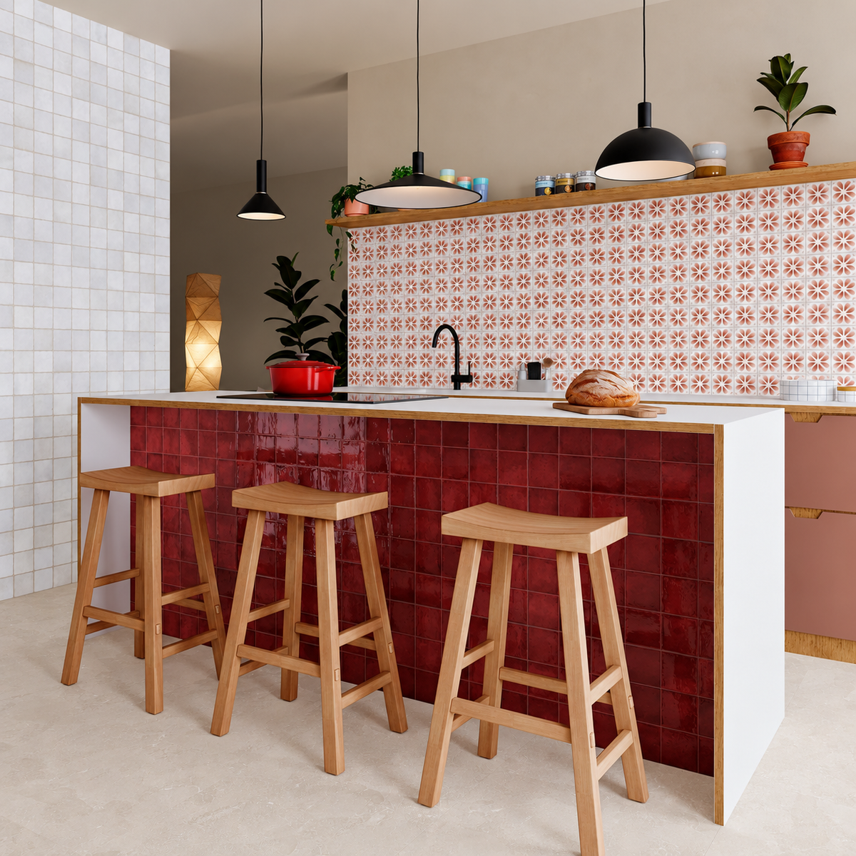 Dakota Flora Port floral kitchen splashback paired with a burgundy tiled island, wooden stools and black pendant lights.