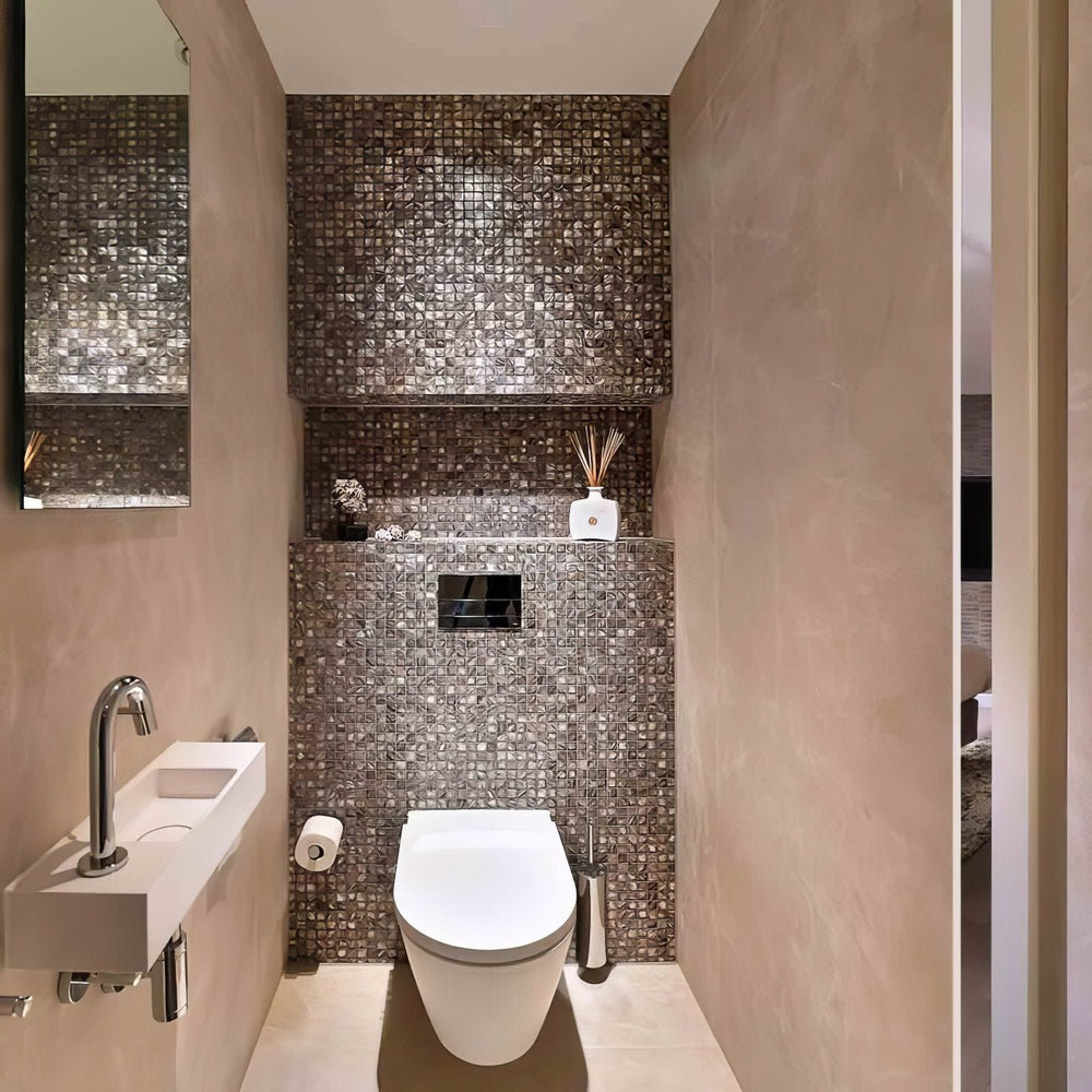 Dove grey mother of pearl mosaic tiles installed on luxury bathroom wall with reflective polished surface