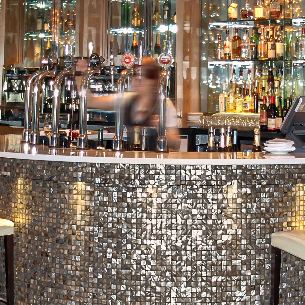 Luxury bar cladding in dove grey mother of pearl mosaic tiles with soft light-reflective finish