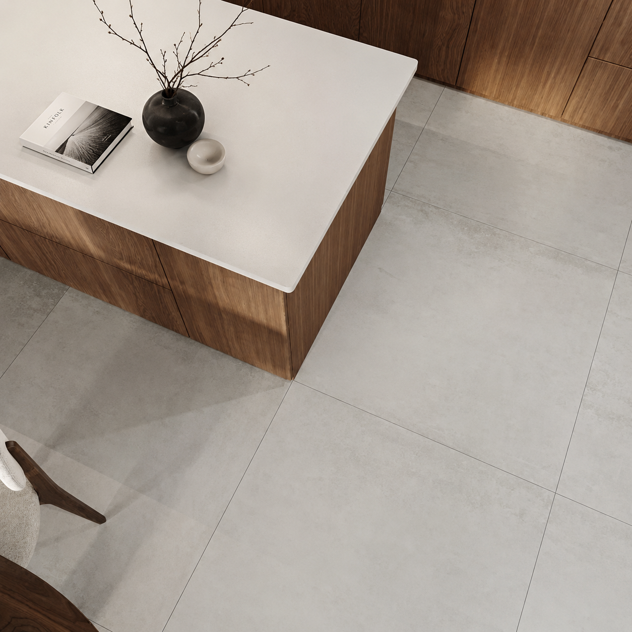 Driftwood pale grey large-format porcelain floor tiles in a luxury walnut kitchen with illuminated cabinetry and central island.