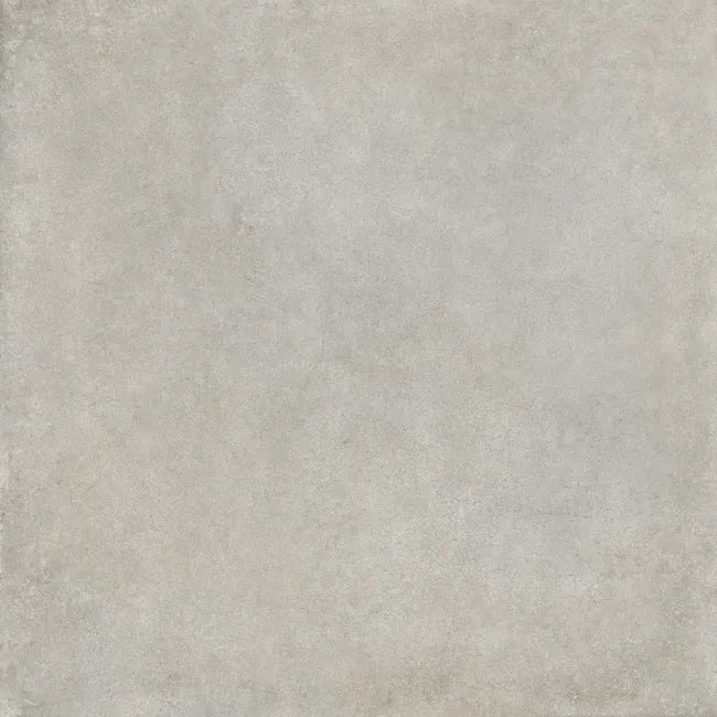 Close-up of Driftwood Pale Grey concrete-style porcelain tile showing its softly mottled matt surface and subtle mineral texture