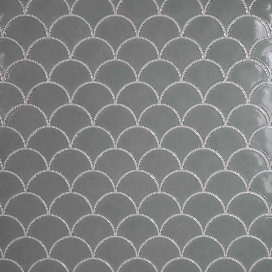 Close-up of glossy petrol grey scallop mosaic tiles with subtle tonal variation and 2 mm Silver Grey grout lines.
