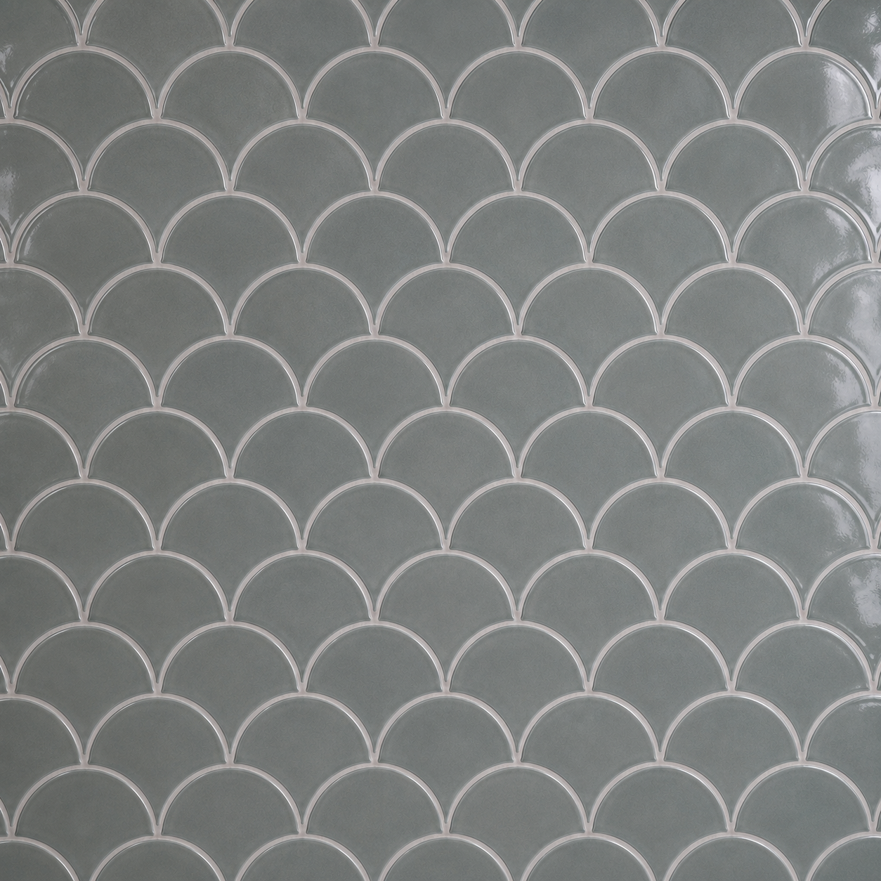 Close-up of glossy petrol grey scallop mosaic tiles with subtle tonal variation and 2 mm Silver Grey grout lines.