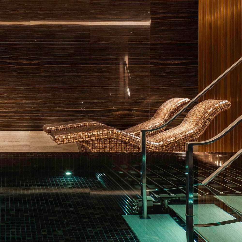 Close-up detail of Gentle Earth shell mosaic tiles highlighting 25mm square format and gloss surface texture