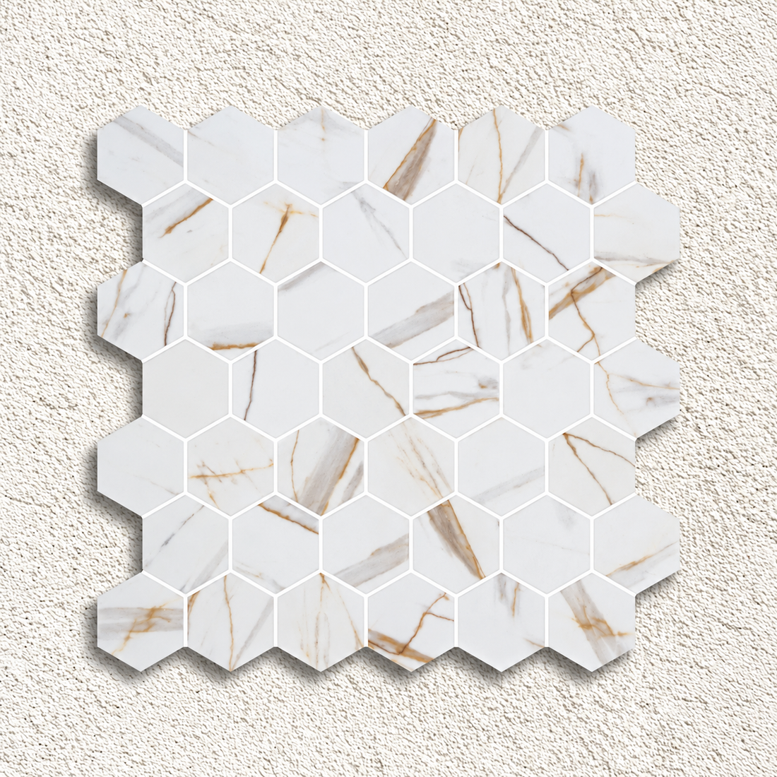 Hex XL Calacatta Gold glass mosaic sheet with 51mm white marble-effect hexagons and a matt finish.