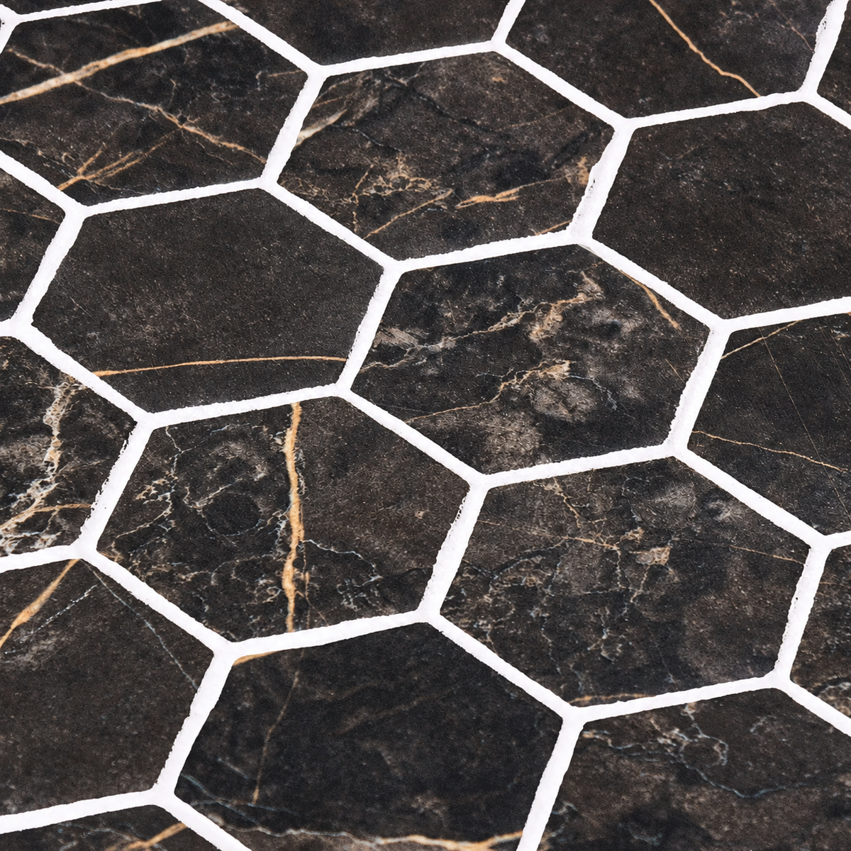 Close-up of Hex XL Coimbra dark matt hexagon mosaic tiles showing warm veining and contrasting white joints.