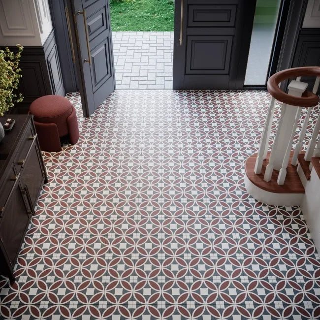 Javanese Terracotta Petal Pattern Porcelain Tile installed in a hallway with dark panelled doors and vintage geometric floor design