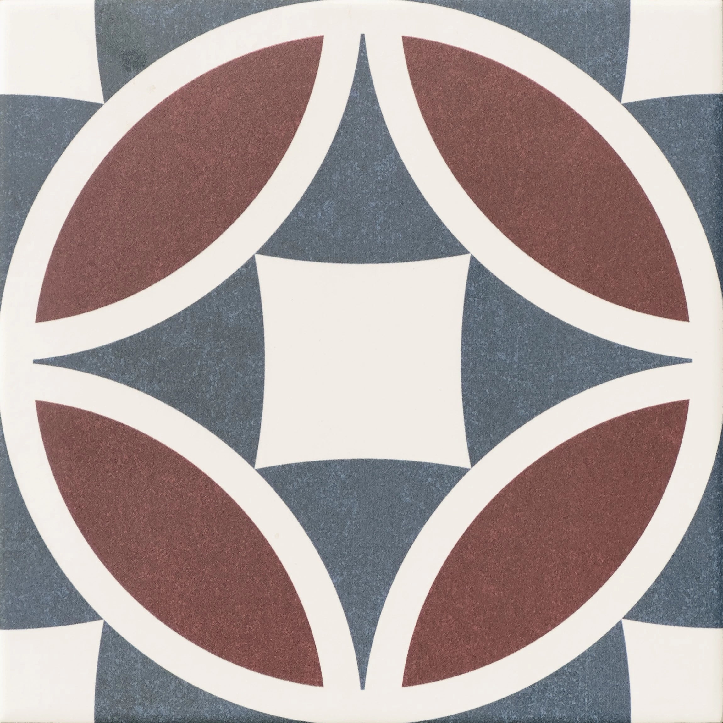 Close-up of Javanese Terracotta Petal Pattern Porcelain Tile showing terracotta petals, blue-grey detail and matt porcelain finish