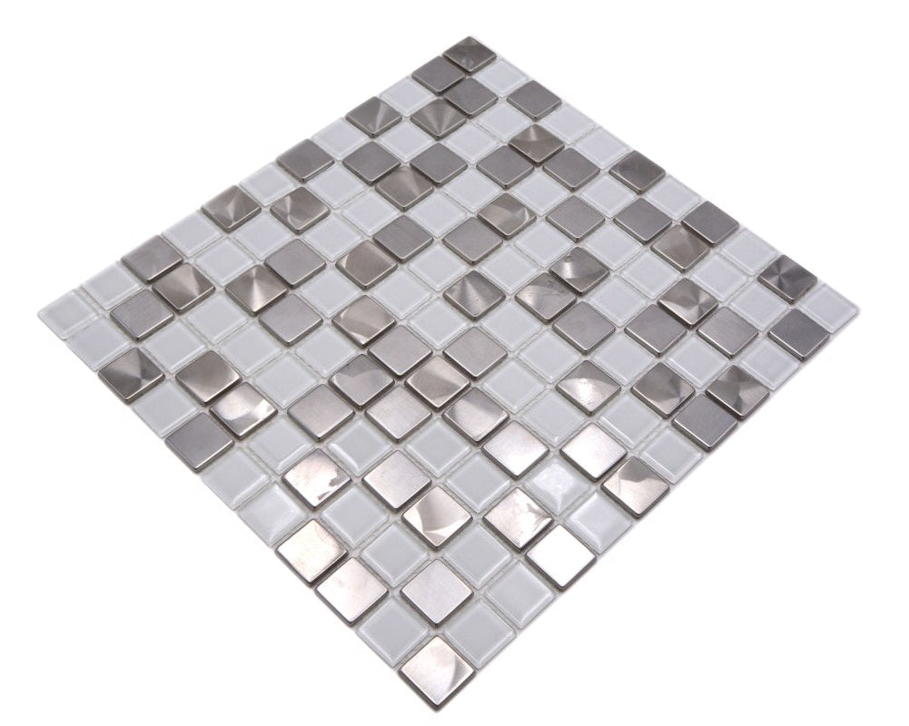Detailed angled view of white glass and silver metal mosaic tiles with glossy reflective finish