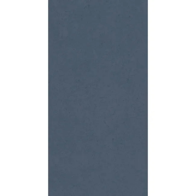 Liscio Avio matt ceramic wall tile 600×300mm with subtle tonal variation across its blue-grey surface.