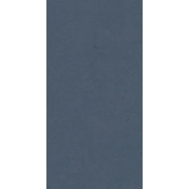 Liscio Avio 600×300mm matt wall tile with muted slate blue colour and softly mottled surface.