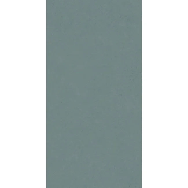Rectangular Liscio Ottanio teal ceramic wall tile with softly mottled matt surface.