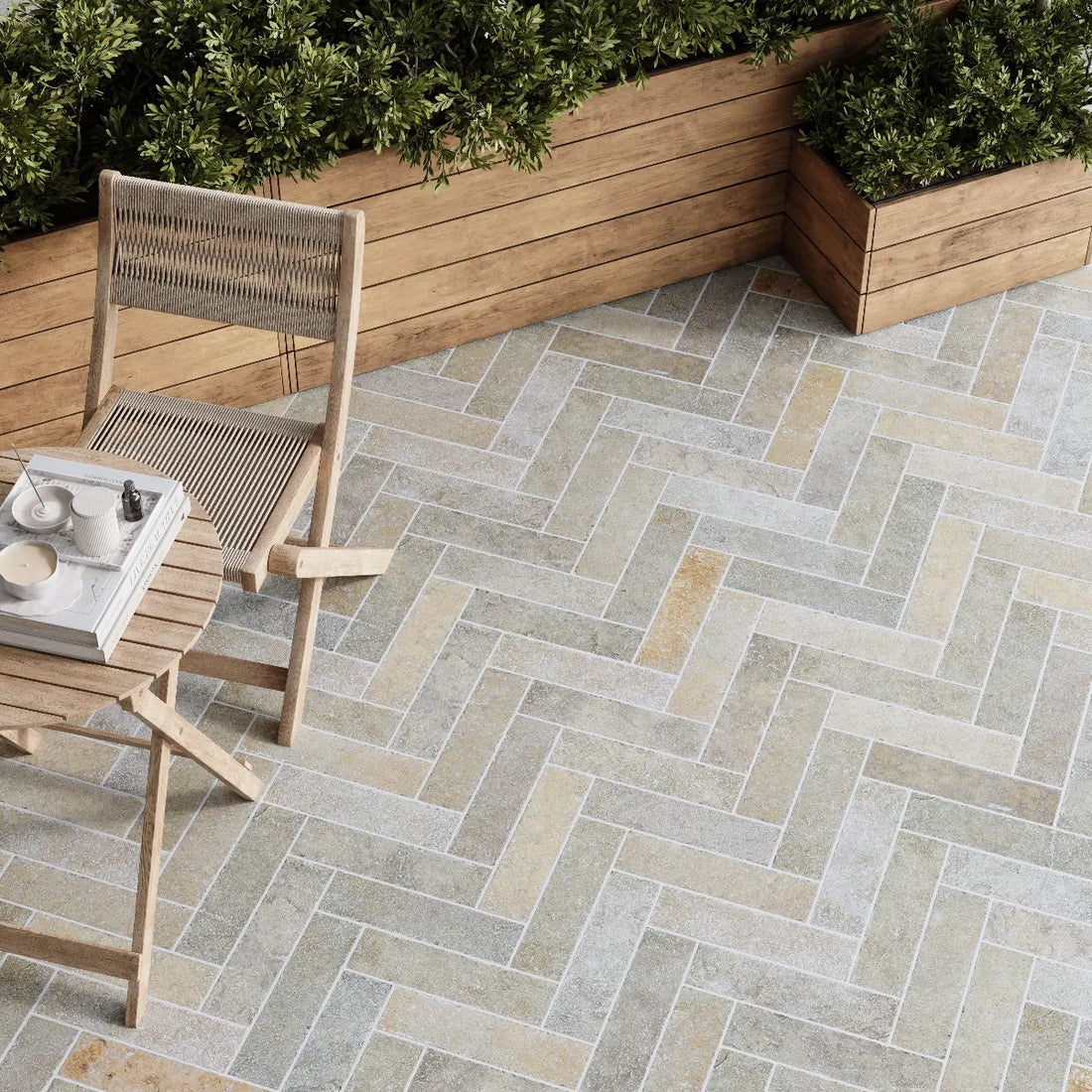 Marlborough Natural Beige Limestone Herringbone Tiles 75x305mm laid on an outdoor terrace with tumbled rustic finish