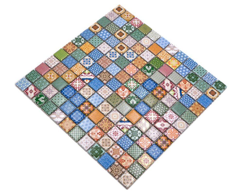 Angled view of Moroccan multicolour mosaic tile sheets with small square patterned ceramic chips on mesh backing.