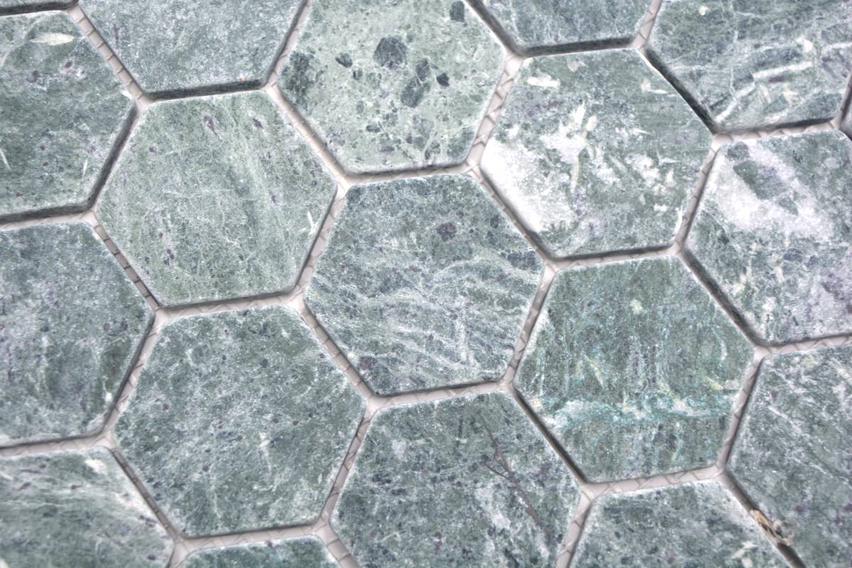 Close-up of honed green marble hexagon mosaic with tumbled edges, natural veining and 3mm grout joints