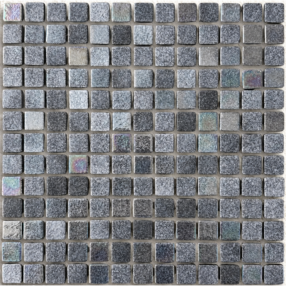 Close Up of Niebla Mix-Iris Murray square glass mosaic tiles showing mottled charcoal and grey tones with a lustre finish.