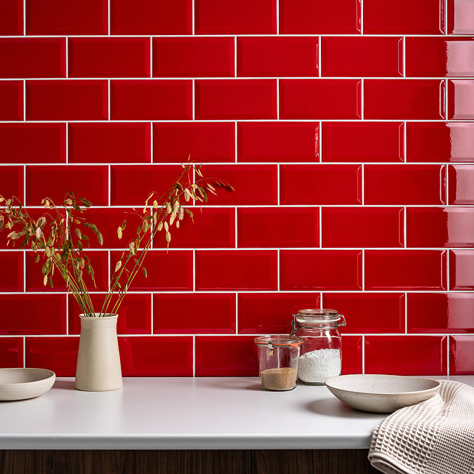 Ruby Red Metro Classic 100x200mm gloss bevelled ceramic tiles installed as a kitchen splashback in brick bond.