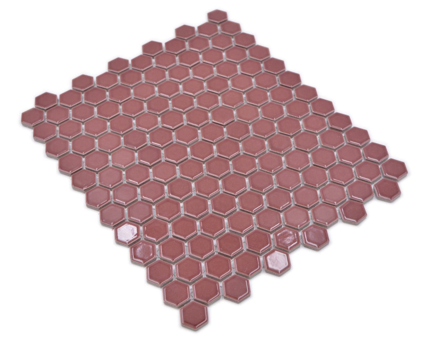 Full Shapes burgundy red hexagon mosaic sheet viewed diagonally against a white background.
