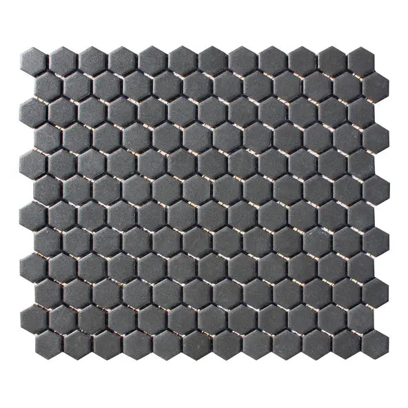 Shapes Hexagon Unglazed Black Mosaic Tile mesh-mounted sheet with small matt black porcelain hexagon chips.