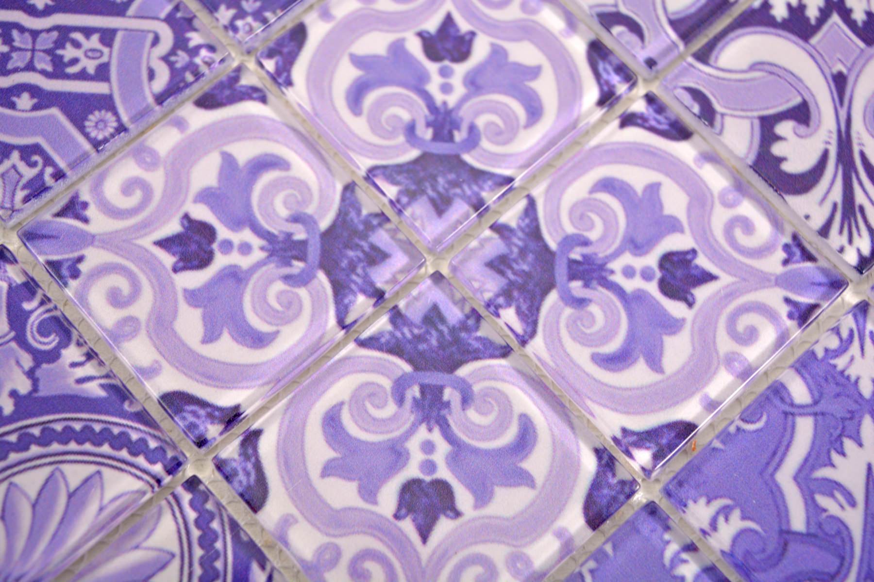 Macro view of glossy purple glass mosaic tiles with ornate floral scroll pattern and 2mm joints.