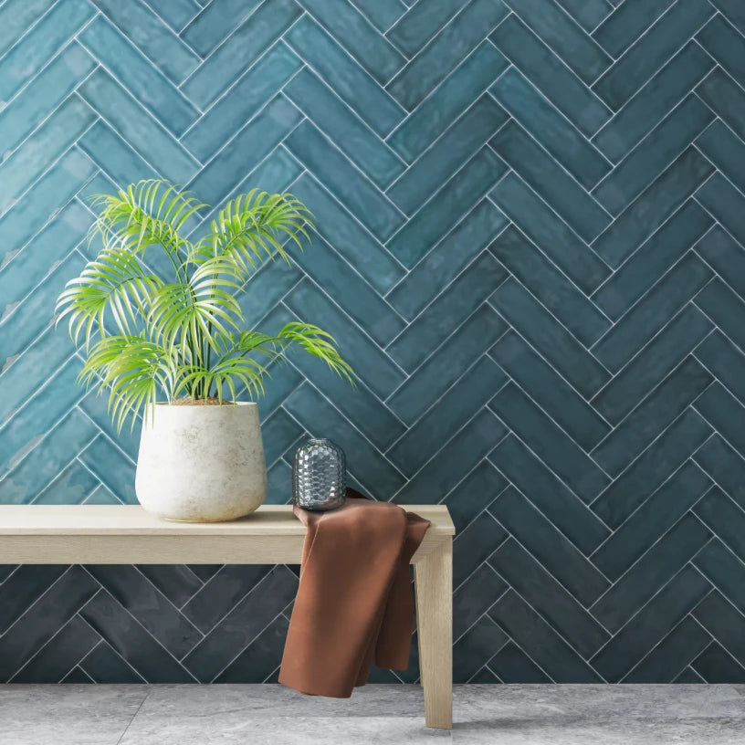 Azure Drift ceramic metro tiles creating a refined bathroom feature wall, blending blue-green tones with a gloss finish that enhances depth and fluid light reflection.