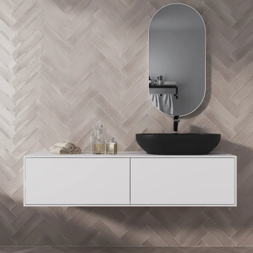 Fawn Stone ceramic metro tiles forming a warm-toned bathroom feature wall, with a gloss finish that subtly shifts under natural and artificial light.