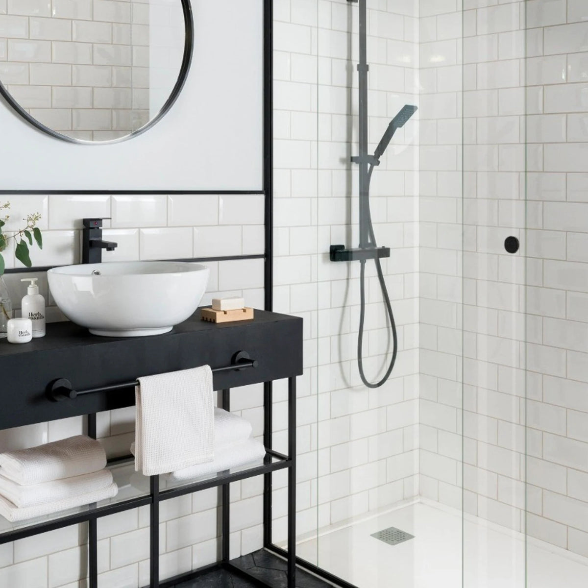 Classico Blanco White Metro 100x200mm gloss bevelled ceramic wall tiles in modern bathroom with black shower fittings