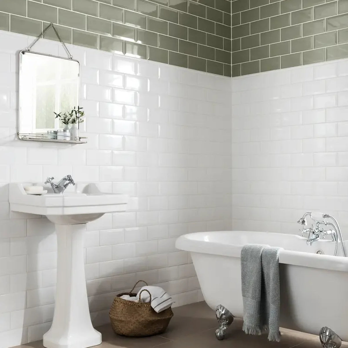 Classico Blanco White Metro bevelled wall tiles in traditional bathroom with freestanding bath and sage green feature tiles