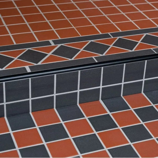 Frost-resistant black mosaic tiles used in outdoor terrace setting