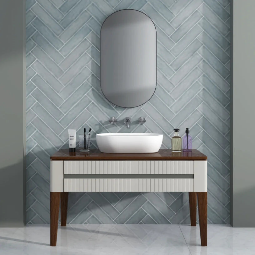 Silver Haze gloss metro tiles forming a contemporary bathroom feature wall, with a soft metallic-grey undertone that shifts subtly under directional lighting.